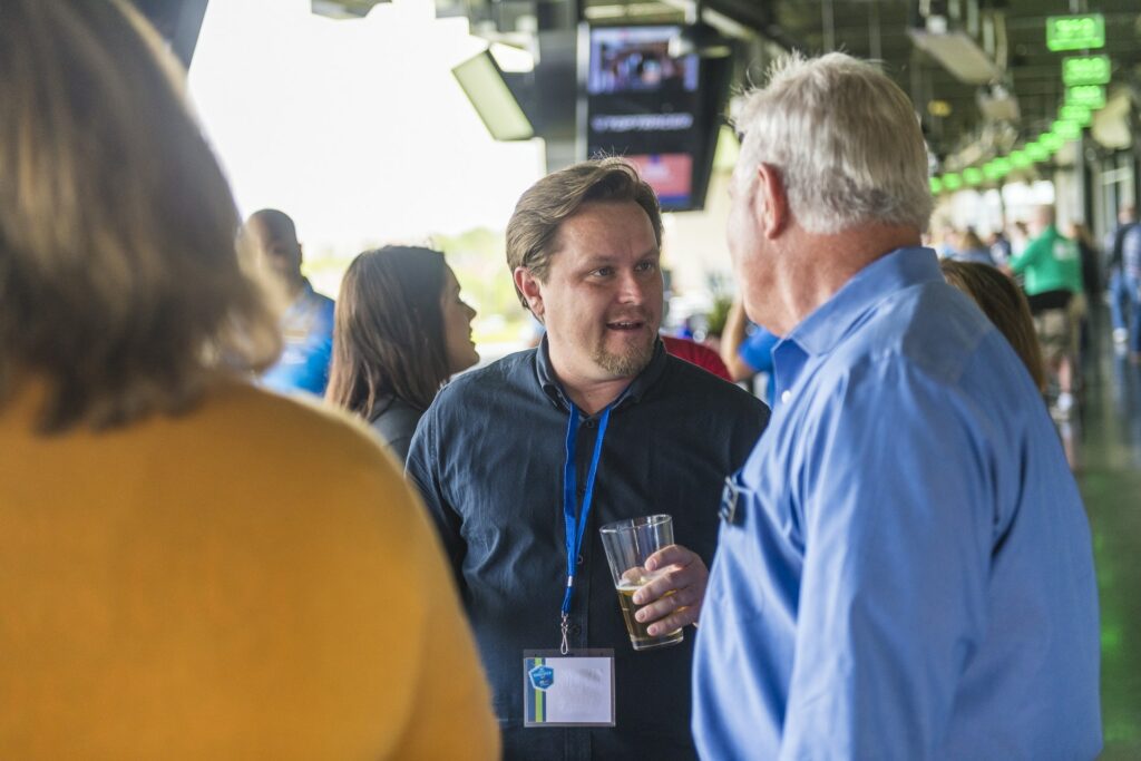 People socializing at Axcet HR Client event meeting in Kansas City